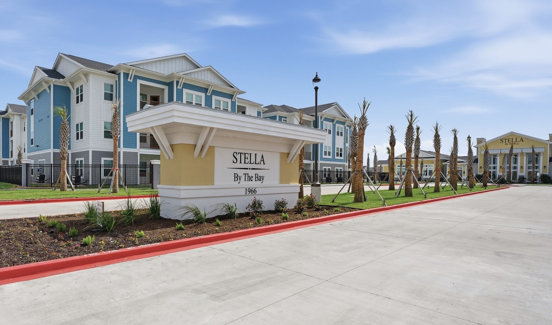a monument sign of Stella by the Bay