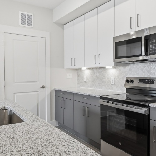 a kitchen with white cabinets